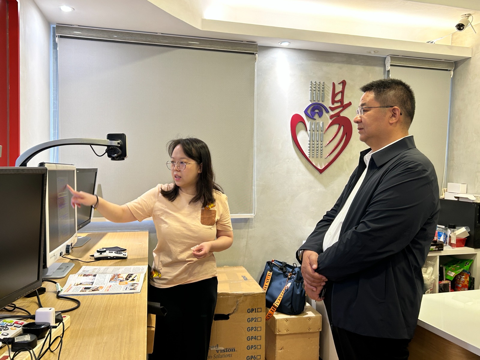 Representative from Beijing School for the Blind visited our headquarter