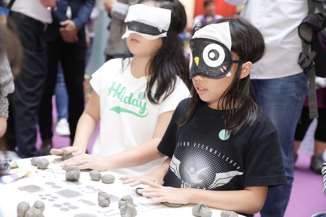 Children participated in the blind-folded ceramics workshop