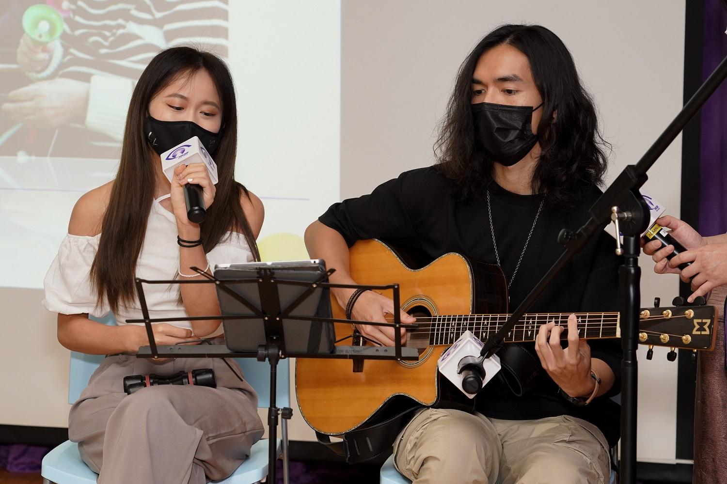 Jamie (left) and Dai Jo, music instructors performed a good song